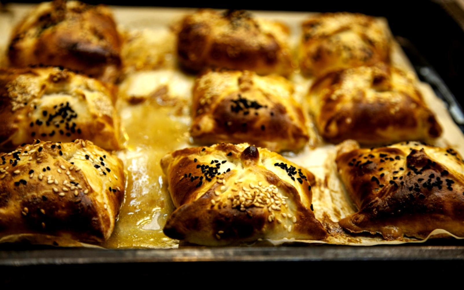 Student working on plating techniques during an advanced culinary session