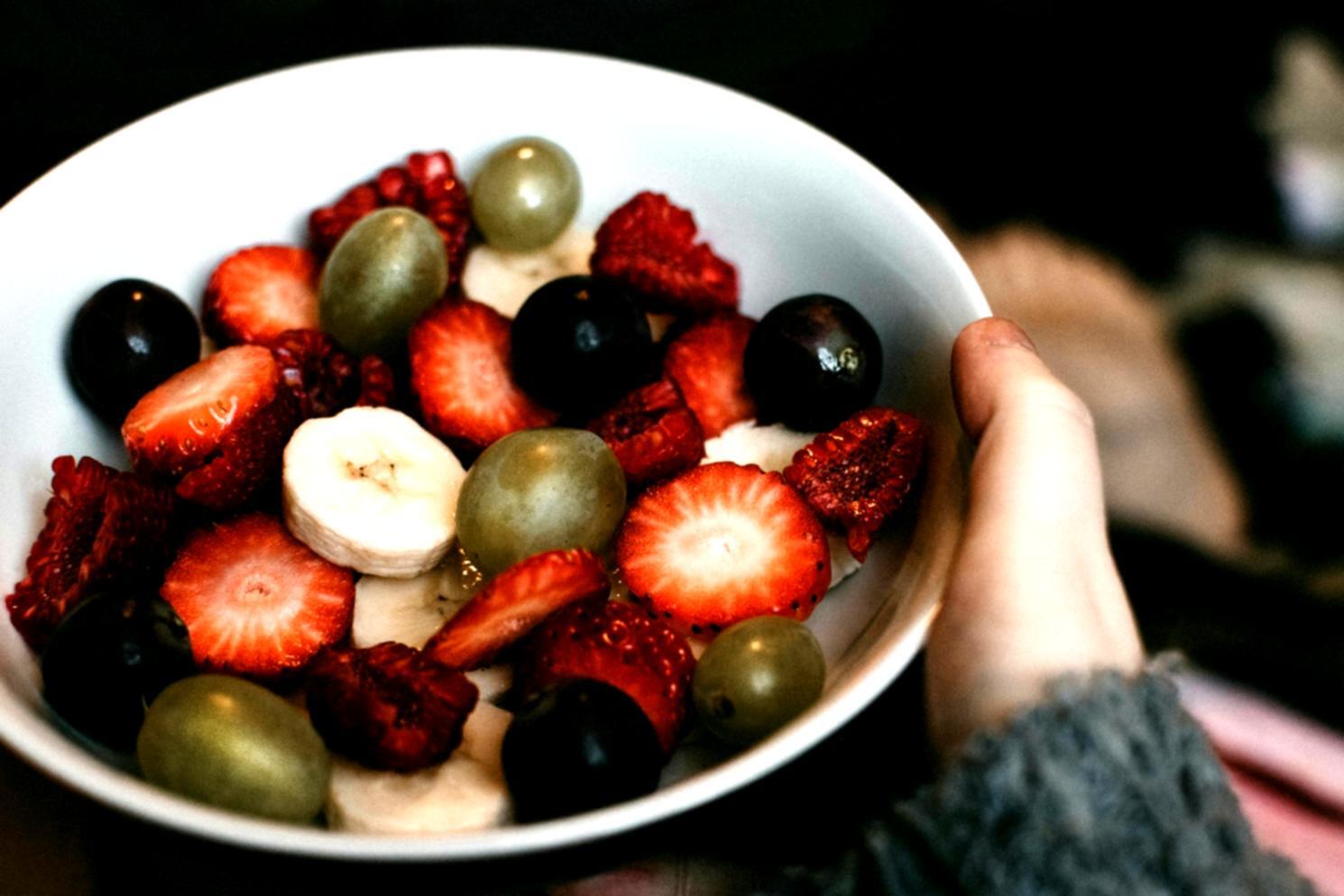 Professional kitchen setting with fresh vegetables and cooking preparation